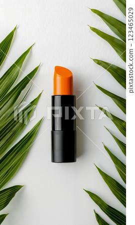 A black and orange lipstick sitting on top of a green leaf A black and orange lipstick sitting on top of a green leaf 123465029