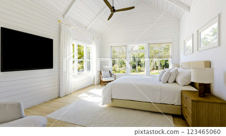 A bedroom with a large bed and a flat screen television 123465060