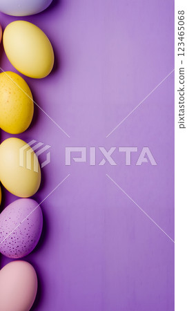 A group of colorful easter eggs on a purple background 123465068