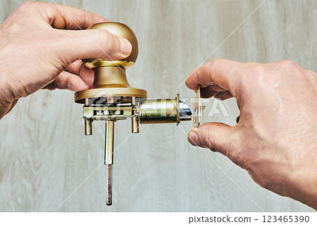 Detail of doorknob assembly shows how spindle interacts with internal latching mechanism. Detail of doorknob assembly shows how spindle interacts with internal latching mechanism. 123465390