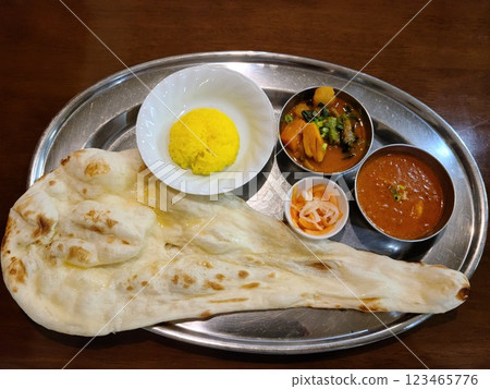 Set of two types of curry sauce and giant naan Set of two types of curry sauce and giant naan 123465776