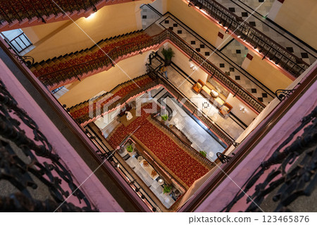 Classic spiral staircase and red carpet interior Classic spiral staircase and red carpet interior 123465876