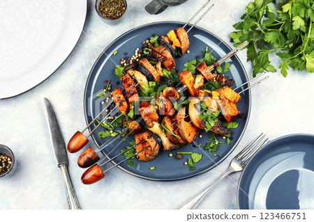 Sweet potato with mushrooms on skewers. 123466751