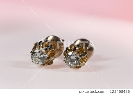 Diamond Earrings Isolated on White Background. Yellow Gold Diamond Earring Pair with 750 Stamp Denoting 18-Carat Yellow Gold. 123468426