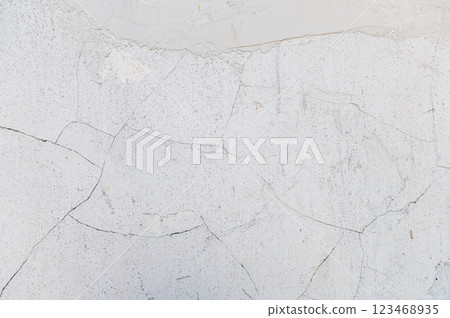 Light cracked wall. Minimalistic soft wall texture with cracked details. 123468935