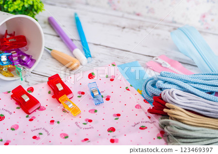 Sewing tools and acrylic string, zippers, and clips Sewing tools and acrylic string, zippers, and clips 123469397