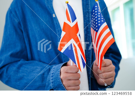 Learn English language, Asian teenage student hold book with flag in course at school. 123469558