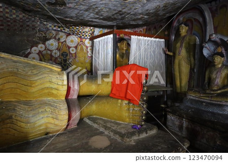 Feet of a reclining Buddha statue at the Rangiri Dambulla cave temple [Sri Lanka] 123470094