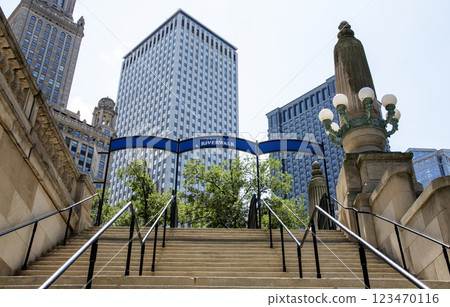 Chicago Riverwalk Entrance With City Buildings in the Background 123470116