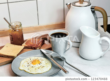 Breakfast with fried egg, toast and coffee 123470488