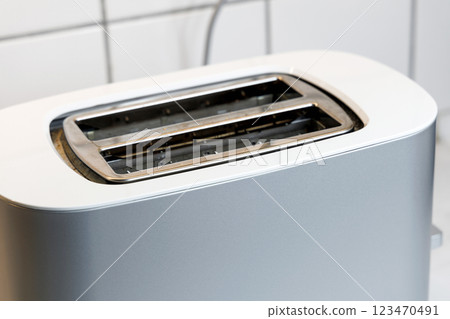 Toaster with two pieces of roasted bread Toaster with two pieces of roasted bread 123470491