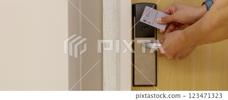 Smart card door key lock system in hotel. Hotel electronic lock on wooden door 123471323