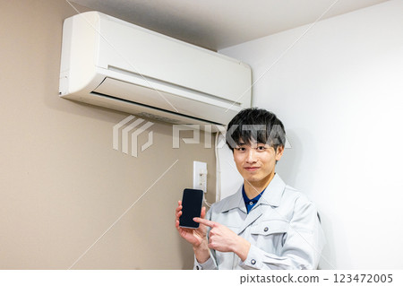 Workers inspecting air conditioners Workers inspecting air conditioners 123472005