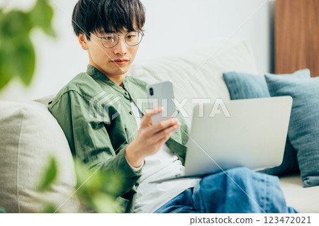 Men looking at smartphones Men looking at smartphones 123472021