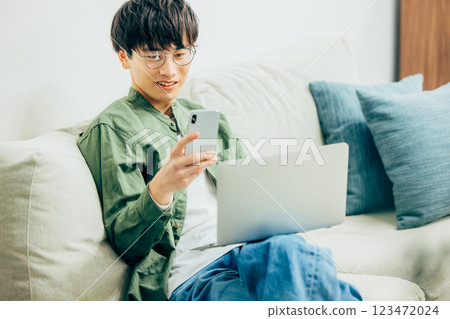 Men looking at smartphones Men looking at smartphones 123472024