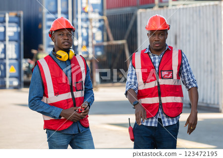 Foreman or worker work at Container cargo site check up goods in container. Foreman or worker work at Container cargo site check up goods in container. 123472195