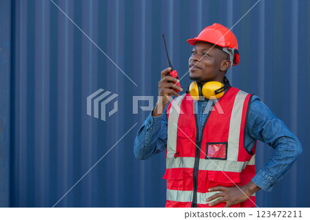 Foreman or worker work at Container cargo site check up goods in container. 123472211