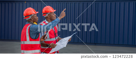 Foreman or worker work at Container cargo site check up goods in container. Foreman or worker work at Container cargo site check up goods in container. 123472228