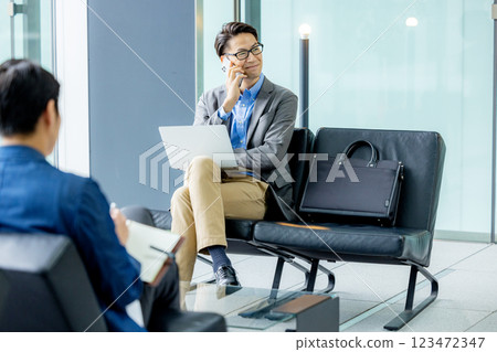 Businessmen working in the lobby Businessmen working in the lobby 123472347