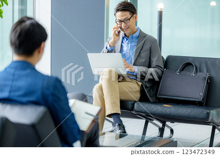 Businessmen working in the lobby Businessmen working in the lobby 123472349