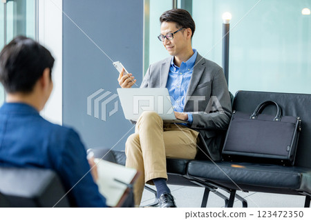Businessmen working in the lobby Businessmen working in the lobby 123472350