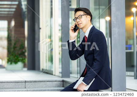 Businessmen talking on a smartphone Businessmen talking on a smartphone 123472460