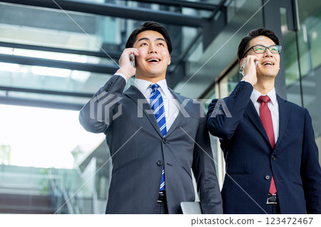 A man in a suit with a smartphone 123472467