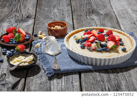 Berry tart with marzipan crust and vegan filling 123473052