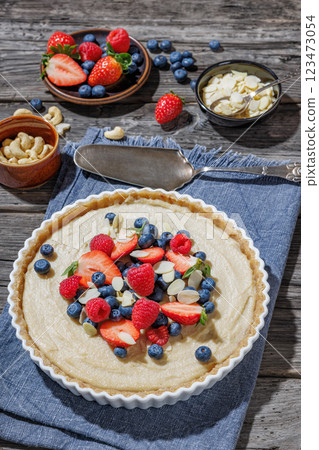 Berry tart with marzipan crust and vegan filling Berry tart with marzipan crust and vegan filling 123473054