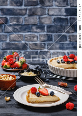 Berry tart with marzipan crust and vegan filling Berry tart with marzipan crust and vegan filling 123473057