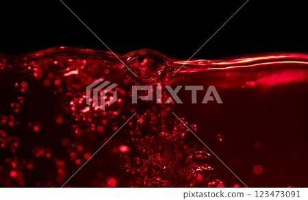 Red wine on a black background, abstract splashing. Red wine on a black background, abstract splashing. 123473091