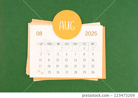 August 2025 calendar page on green background. August 2025 calendar page on green background. 123473209
