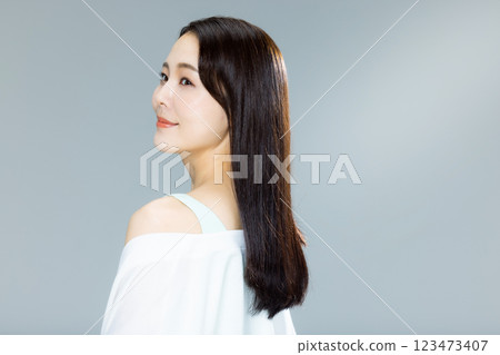 woman blowing her hair 123473407