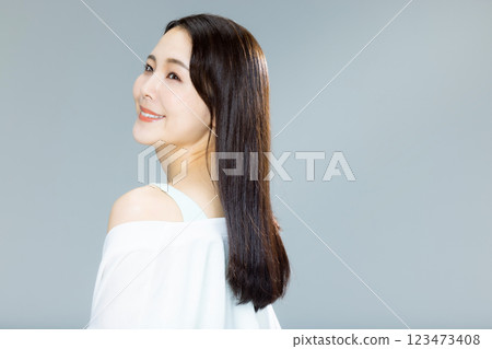 woman blowing her hair woman blowing her hair 123473408