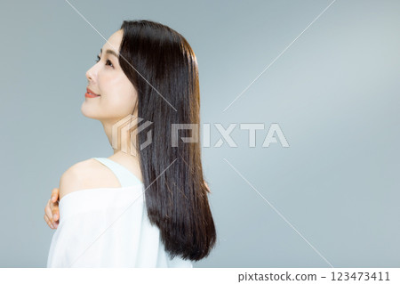 woman blowing her hair woman blowing her hair 123473411