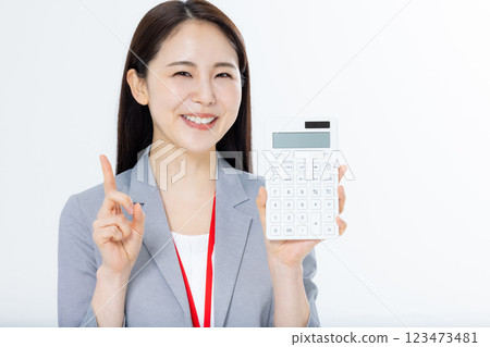 Business woman with calculator Business woman with calculator 123473481