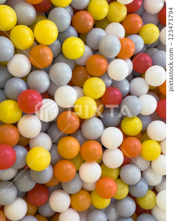 Colorful assortment of plastic balls fills play area in a recreational facility 123473794