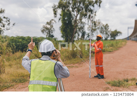 Engineer surveyor team Use drone for operator inspecting and survey construction site Engineer surveyor team Use drone for operator inspecting and survey construction site 123473804