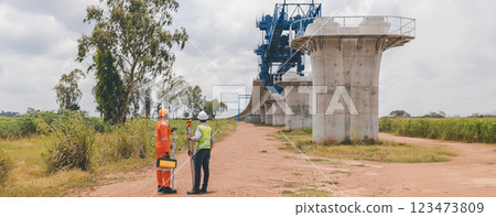 Engineer surveyor team Use drone for operator inspecting and survey construction site Engineer surveyor team Use drone for operator inspecting and survey construction site 123473809