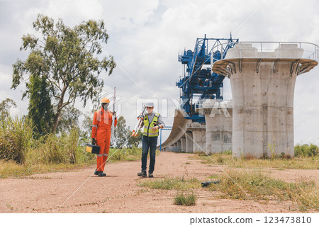 Engineer surveyor team Use drone for operator inspecting and survey construction site Engineer surveyor team Use drone for operator inspecting and survey construction site 123473810
