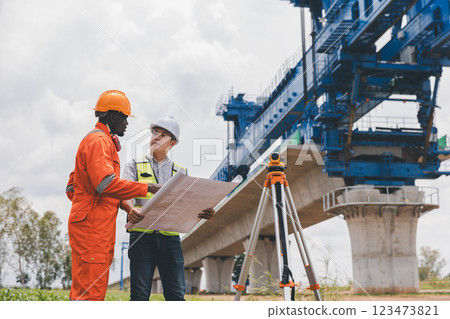 Engineer surveyor team Use drone for operator inspecting and survey construction site Engineer surveyor team Use drone for operator inspecting and survey construction site 123473821