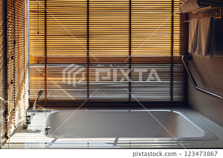 Bath tub with White foam soap bubbles. Modern ceramic bathtub	 123473867
