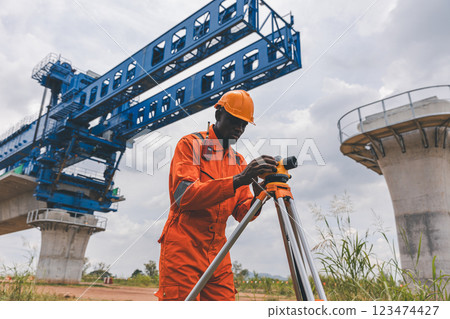 Engineer surveyor team Use drone for operator inspecting and survey construction site. 123474427