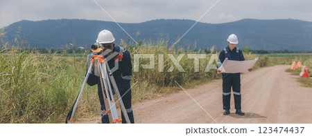 Engineer surveyor team Use drone for operator inspecting and survey construction site. 123474437