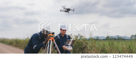 Engineer surveyor team Use drone for operator inspecting and survey construction site. Engineer surveyor team Use drone for operator inspecting and survey construction site. 123474449