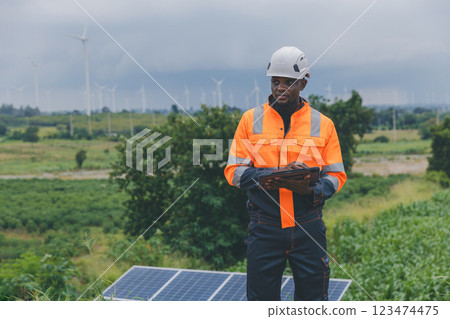 Engineer Checking solar panels in agriculture farm land. 123474475