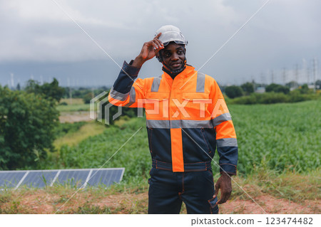Engineer Checking solar panels in agriculture farm land. Engineer Checking solar panels in agriculture farm land. 123474482