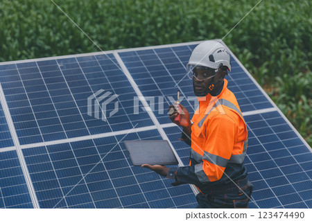 Engineer Checking solar panels in agriculture farm land. Engineer Checking solar panels in agriculture farm land. 123474490