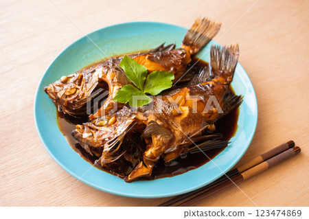 Boiled rockfish served on a light blue plate Boiled rockfish served on a light blue plate 123474869