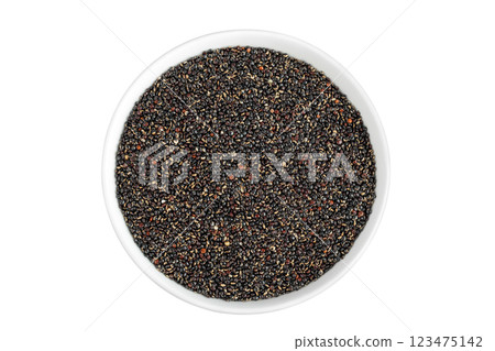 black quinoa in ceramic bowl isolated on white background. Top view. Flat lay 123475142